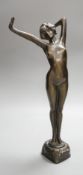 An Art Nouveau style female bronze nude. 39cms high.