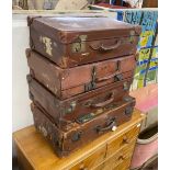 Four vintage suitcases, largest 70 x 40cm
