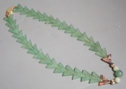 A Chinese jade arrowed pendant necklace
