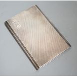 A George V engine turned silver rectangular cigarette case, 12.2cm, with engraved initials.