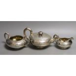 An early Victorian engraved silver three piece tea set, W.E, London, 1839, gross 38oz. Ivory