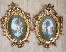 A pair of miniature Italianate landscapes, with pierced, carved oval giltwood frames. 29cm high