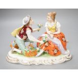 A Sitzendorf porcelain figure group of a romance. 13cm high