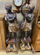 A pair of Italian carved wood Blackamoor torcheres, with a pair of six branch lights now detached,