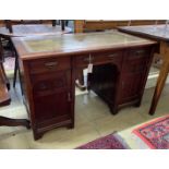 A late Victorian Aesthetic movement oak kneehole writing table, width 120cm, depth 60cm, height