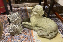 Two reconstituted stone garden ornaments, recumbent hound and seated cat, larger height 34cm