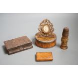 A 19th century circular white metal mounted burr wood snuff box and assorted small carvings