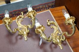 A pair of French ormolu two branch sconces, 27cms high,