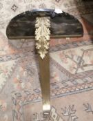 A marble topped D shaped console table with gilt metal acanthus upright