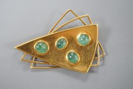 A stylish continental 750 yellow metal triple triangle brooch, mounted with four cabochon