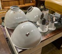 A set of three vintage industrial enamel shades