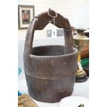 A Chinese bucket and pair of clogs, bucket 57cms high,