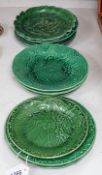 A collection of Victorian greenware leaf plates and dishes