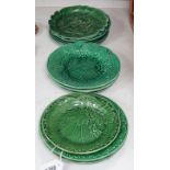 A collection of Victorian greenware leaf plates and dishes