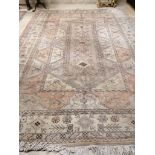 A large Caucasian Turkish design fawn ground rug, 420 x 300cm