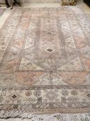 A large Caucasian Turkish design fawn ground rug, 420 x 300cm