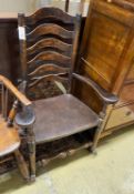 A 19th century ash and elm ladder back rocking elbow chair, width 66cm, depth 40cm