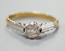 A modern 18ct gold and solitaire diamond ring, size M, gross weight 2.7 grams.