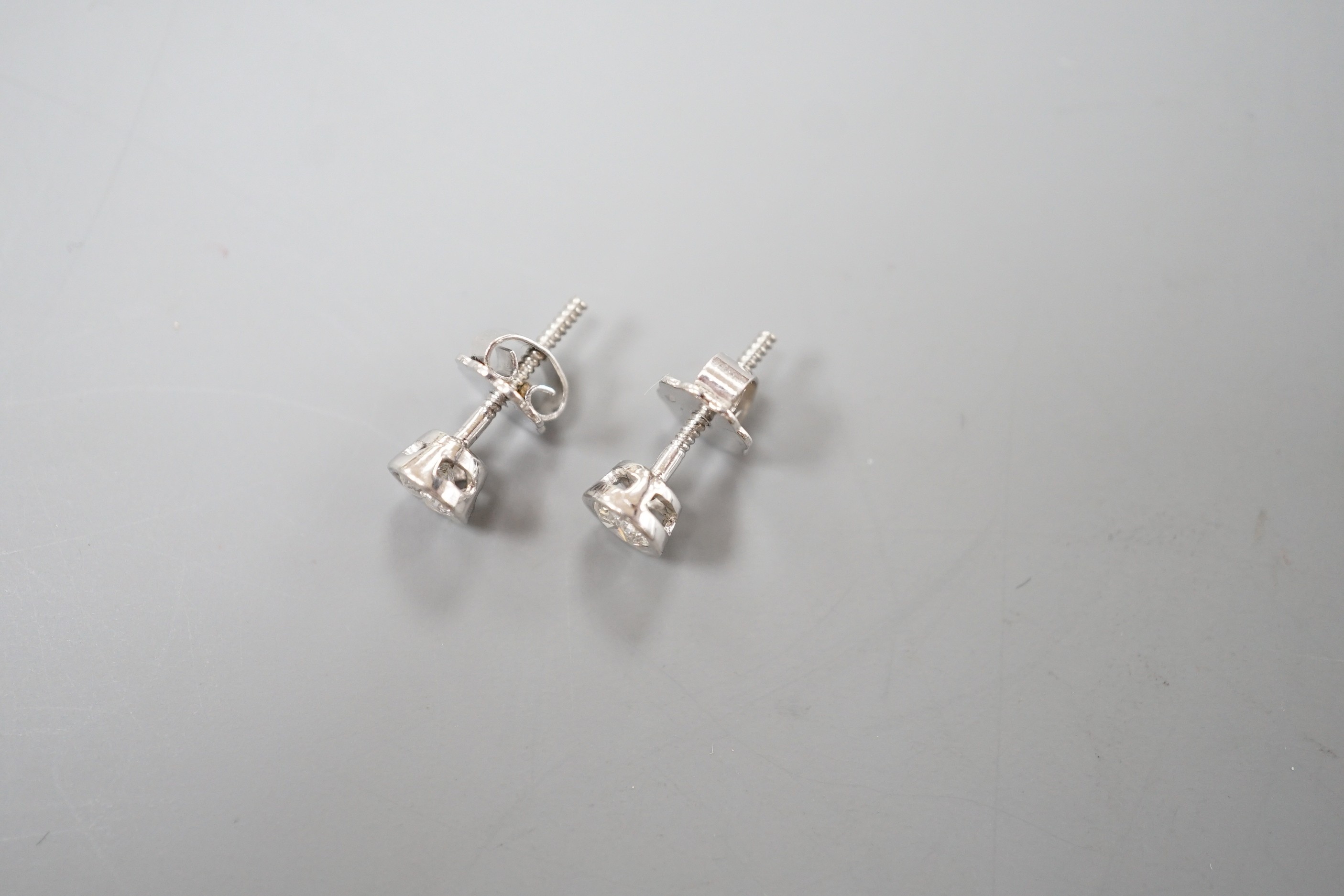 A pair of 750 white metal and collet set solitaire diamond ear studs, gross weight 1.5 grams, - Image 3 of 4