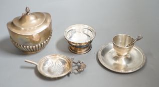 A late Victorian silver half-fluted tea caddy, Birmingham, 1900, a silver strainer on stand, a
