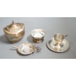 A late Victorian silver half-fluted tea caddy, Birmingham, 1900, a silver strainer on stand, a