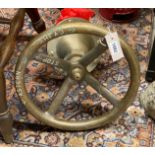 A vintage Merryweather extinguisher and ship's wheel