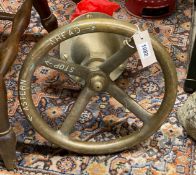 A vintage Merryweather extinguisher and ship's wheel