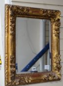 A 19th century rectangular carved giltwood and composition wall mirror, width 47cm, height 58cm