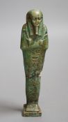 An Egyptian turquoise glazed faience ushabti, possibly Late Kingdom. 14.5cm