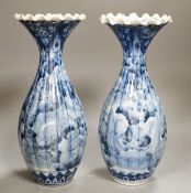 A pair of early 20th century Japanese fluted blue and white flared rim vases, 31.5cm