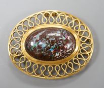 A continental 750 yellow metal and large oval boulder? opal set pendant brooch, with a filigree