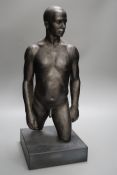 A bronzed plaster nude male torso, 48cms high,