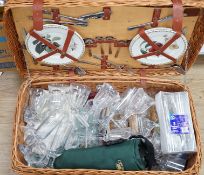 A wicker picnic hamper with assorted Glyndebourne plastic goblets, hamper 72cms wide x 39cms deep,