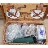 A wicker picnic hamper with assorted Glyndebourne plastic goblets, hamper 72cms wide x 39cms deep,