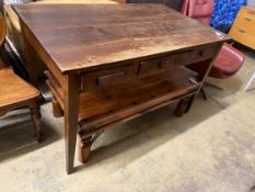 A mid century oak writing table with planked top and three drawers, length 130cm, depth 78cm, height