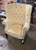 A Georgian style button back wing armchair, width 80cm, height 114cm