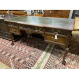 A George II style mahogany breakfront kneehole desk, width 152cm, depth 68cm, height 75cm