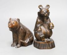 A Black Forest carved bear and a similar Japanese seated model of a bear, 15.5cm