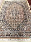 A North West Persian blue ground carpet, 260 x 170cm