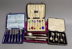 Four assorted cased sets of cutlery including a christening trio and a cased set of six silver and