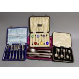 Four assorted cased sets of cutlery including a christening trio and a cased set of six silver and