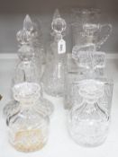A group of assorted glass decanters and two vases