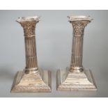 A pair of late Victorian silver Corinthian column dwarf candlesticks, W & G Sissons, London, 1897,