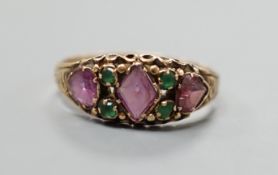 A Victorian gold, garnet? and emerald set half hoop ring, size, gross weight 1.8 grams.