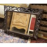 A Victorian rectangular carved oak bevelled glass mirror, width 88cm, height 70cm