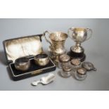 A Victorian repousse silver christening mug, Birmingham, 1861, 9.5cm, a cased pair of silver