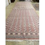 A pair of Bokhara peach ground carpets, 310 x 218cm