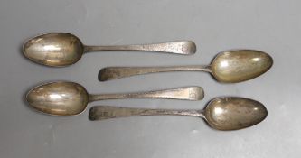 A set of four George III silver feather edge engraved Old English pattern table spoons, by George