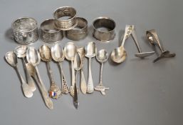 A miscellaneous collection of small silver items to include napkin rings, spoons, etc.
