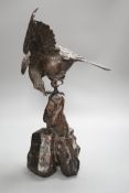 A Japanese bronze model of an eagle on a rock, Meiji period, 40cms high.